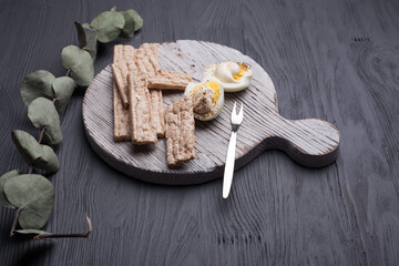 Hot coffee cup and breakfast baked on wooden board. Cup of tasty coffee with tasty cookies, on beige background. americano coffee and cookies with white berries. White Coffee Cup.