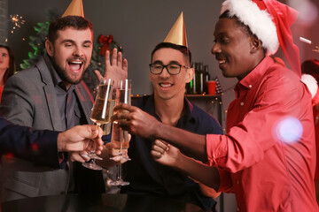 Young men celebrating New Year in night club
