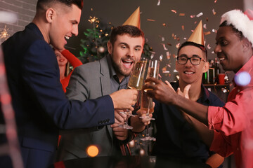 Young men celebrating New Year in night club