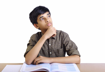 Indian School Boy Posing to Camera with textbook	