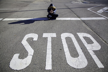 Woman at stop sign