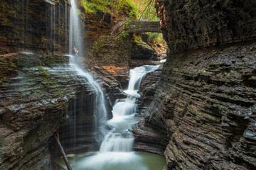 Fototapeta na wymiar Visitors walking through the Waterfalls of the Watkins Glen State Park, New York