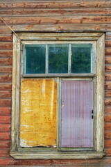 Partially clogged window of the early twentieth century in Estonian style