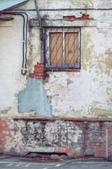 Fragment of the wall texture of the early twentieth century with various chips and scuffs
