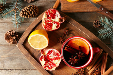 Cup of tasty mulled wine on table