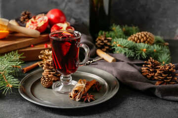 Glass cup of tasty mulled wine on table