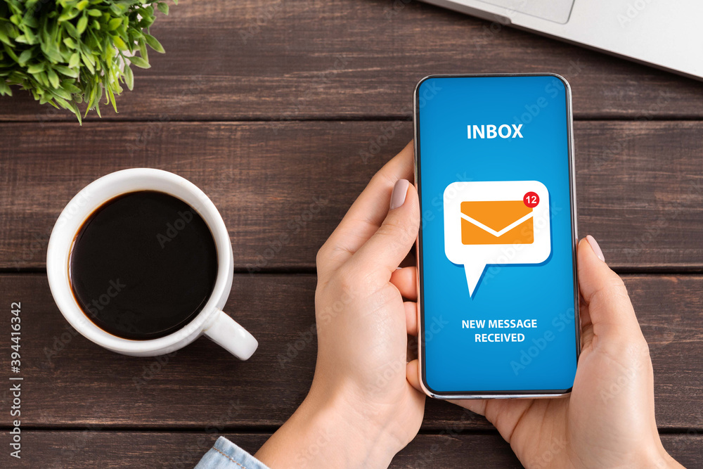 Aufkleber flat lay of unrecognizable young woman checking her inbox for incoming email messages at desk during