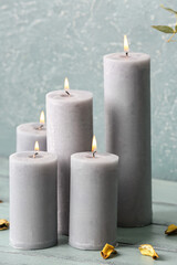 Beautiful aroma candles on table in room