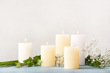 Fototapeta na wymiar Beautiful aroma candles on table in room