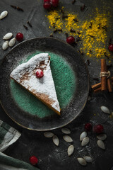 pumpkin pie with icing sugar and berries