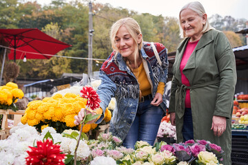 Woman buying flowers in the market