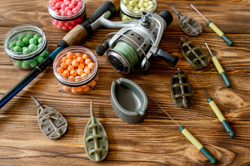 Accessories for carp fishing and fishing baits on wooden planks with copy space