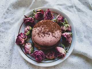 macaroon in dry flowers on a white background