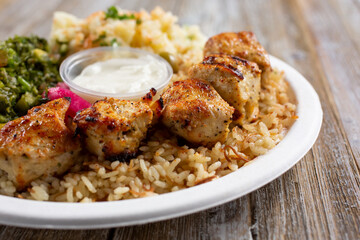 A view of a chicken shish kabob plate.