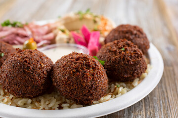 A closeup view of a plate of falafels.