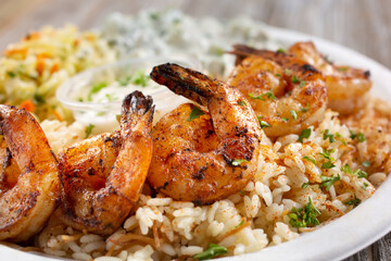 A view of a plate of shrimp kabob.