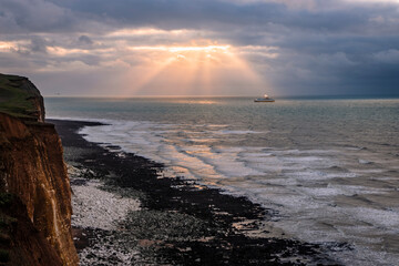 View east from Peacehaven cliffs of a ferry returning to port at Newhaven in east Sussex south east England