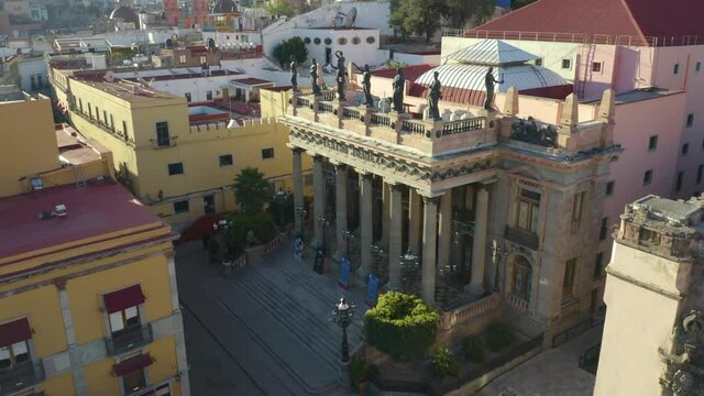 Aerial Dolly In/Pan Down Reveals Famous Teatro Juarez in Guanajuato, Mexico. Day