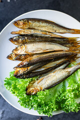 sardine fish sprats smoked or salted seafood mackerel on the table tasty serving size top view copy...