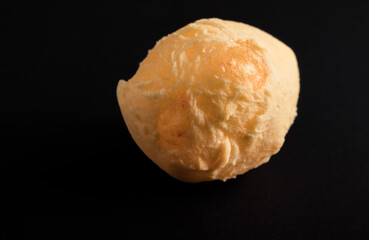 Brazilian cheese bread 'pao de queijo'. Isolated on Black Background.