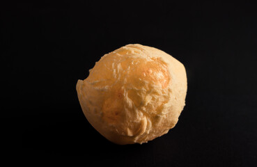Brazilian cheese bread 'pao de queijo'. Isolated on Black Background.