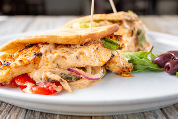 A view of a chicken kabob pita wrap.