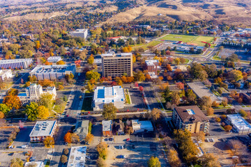 Aerial view of small-town USA with fall colored trees and some buildings
