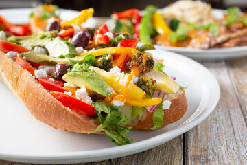 A view of a Mediterranean vegetarian hero sandwich.