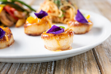 A view of a gourmet dish of scallops.