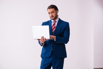 Handsome male realtor working indoors