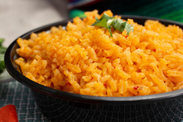 A closeup view of a bowl of Mexican rice.
