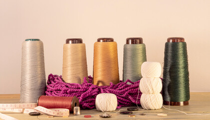 Fototapeta na wymiar threads accessories for needlework on a sewing machine