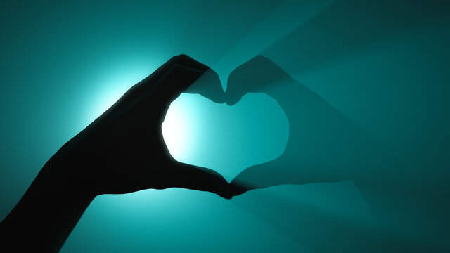 Heart shape. Hand gesture. Turquoise spotlight in background