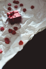 Fototapeta na wymiar Valentines Day gift in red box with heart shape decor