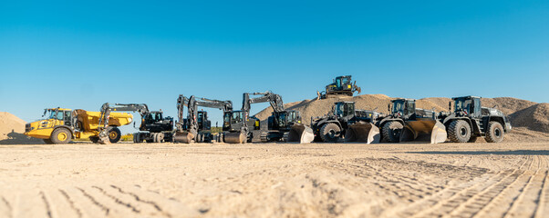 Diggers, excavators and other heavy machines in mine of quarry