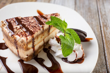 A view of a plate of tiramisu cake.