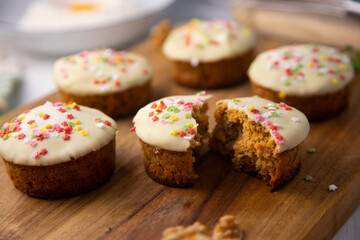 Mini carrot cake with white chocolate cover and sprinkles