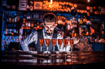 Barman concocts a cocktail on the pothouse