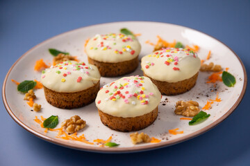 Mini carrot cake with white chocolate cover and sprinkles