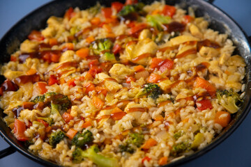 Traditional spanish paella with vegetables and chicken.