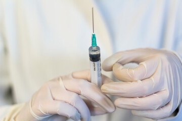 Medic ,scientist, pharmacist holding Syringe. Coronavirus, Covid-19 vaccine concept