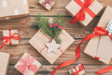 Many Handmade zero waste Christmas gift boxes on wooden background. Christmas background with...
