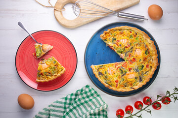 Traditional salmon quiche with broccoli and vegetables