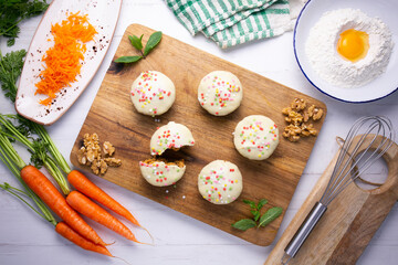 Mini carrot cake with white chocolate cover and sprinkles