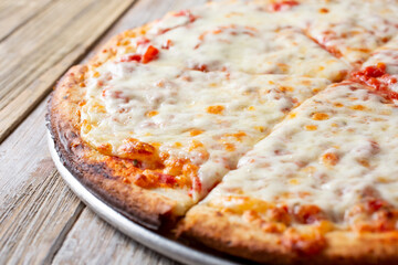 A closeup view of a cheese pizza.