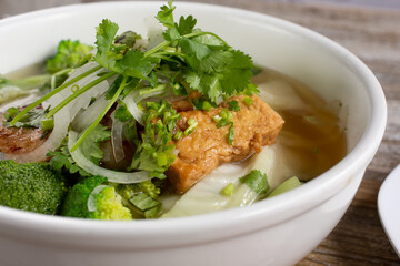 A closeup view of a bowl of pho.