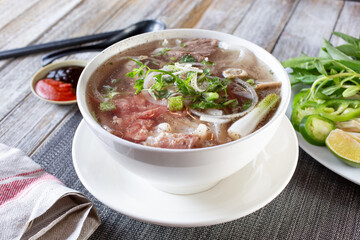 A view of a bowl of beef pho.