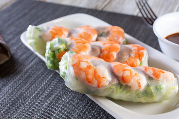 A view of a plate of spring rolls.