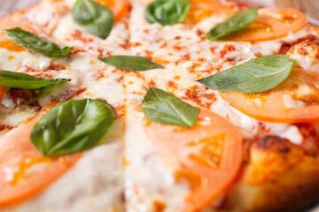 A closeup view of a Margherita pizza.
