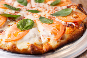 A closeup view of a Margherita pizza.